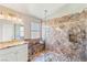 The main bathroom features dual sinks, granite counters, and a custom glass shower at 286 Bowsprit Ct, Las Vegas, NV 89183