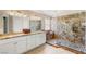 The main bathroom features dual sinks, granite counters, and a custom glass shower at 286 Bowsprit Ct, Las Vegas, NV 89183
