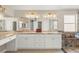 The main bathroom features dual sinks, granite counters, and a custom glass shower at 286 Bowsprit Ct, Las Vegas, NV 89183