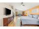 Spacious main bedroom with a ceiling fan, tv, and lots of natural light at 286 Bowsprit Ct, Las Vegas, NV 89183