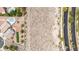 Aerial perspective highlighting a home with turfed lawn, a pool, and patio within a desert-landscaped backyard at 3169 Crystal Moon Rd, Henderson, NV 89052