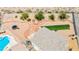 Bird's eye view showcases home with pool, trampoline, and turfed backyard, great for recreation and entertainment at 3169 Crystal Moon Rd, Henderson, NV 89052