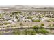 Wide aerial shot displays residential neighborhood with desert landscape, showcasing community and nearby airport at 3169 Crystal Moon Rd, Henderson, NV 89052