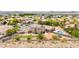 Aerial view of a large property with a pool, turfed area, and desert landscaping in a desert suburban community at 3169 Crystal Moon Rd, Henderson, NV 89052