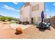 Spacious backyard featuring gravel, a patio, and outdoor seating with mountain views at 3169 Crystal Moon Rd, Henderson, NV 89052