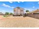 Large backyard features patio seating, gravel, and mountain views in a serene setting at 3169 Crystal Moon Rd, Henderson, NV 89052