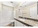 Bathroom featuring granite countertops, tile flooring, and a bathtub-shower combo at 3169 Crystal Moon Rd, Henderson, NV 89052