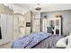 Open primary bedroom featuring a fireplace, a ceiling fan, and carpeted floors at 3169 Crystal Moon Rd, Henderson, NV 89052