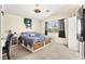 Cozy bedroom with storage bed, ceiling fan, and natural light from the window at 3169 Crystal Moon Rd, Henderson, NV 89052