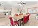 Dining area showcasing a wooden table, red chairs, and view to the kitchen at 3169 Crystal Moon Rd, Henderson, NV 89052