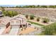 Two-story home featuring a two-car garage and a beautifully xeriscaped front yard with artificial turf at 3169 Crystal Moon Rd, Henderson, NV 89052