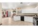 Bright kitchen with white cabinets, granite countertops, and stainless steel appliances at 3169 Crystal Moon Rd, Henderson, NV 89052