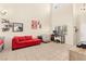 Spacious living room with high ceilings, tile floors, and large window bringing in plenty of light at 3169 Crystal Moon Rd, Henderson, NV 89052