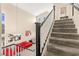 Carpeted staircase with natural light, leading to a cozy living room area below at 3169 Crystal Moon Rd, Henderson, NV 89052