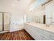 Bathroom featuring double sinks, a soaking tub, and a separate glass shower at 324 Quiet Harbor Dr, Henderson, NV 89052