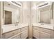 Bathroom features dual sinks with a large mirror and white cabinetry at 324 Quiet Harbor Dr, Henderson, NV 89052