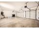 Spacious three car garage has three doors with garage door openers and epoxy flooring at 324 Quiet Harbor Dr, Henderson, NV 89052