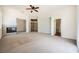 Bright, open living room with a fireplace and multiple doorways creating a spacious feel at 324 Quiet Harbor Dr, Henderson, NV 89052