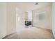 Bright living area with a corner fireplace, carpet and natural light from a window at 324 Quiet Harbor Dr, Henderson, NV 89052