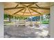 Park pavilion with concrete floor and picnic tables provide shade for park visitors at 324 Quiet Harbor Dr, Henderson, NV 89052