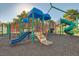 Outdoor playground featuring multiple slides and climbing equipment on a rubber surface at 324 Quiet Harbor Dr, Henderson, NV 89052