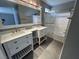 Modern bathroom with double sinks and a glass-enclosed shower at 3736 Steinbeck Dr, Las Vegas, NV 89115