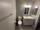 Cozy bathroom featuring a toilet, a mirror and a vanity at 3736 Steinbeck Dr, Las Vegas, NV 89115