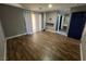 Spacious bedroom with wood floors, large windows, and an ensuite bathroom at 3736 Steinbeck Dr, Las Vegas, NV 89115