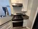 Clean kitchen featuring a stainless steel stove and hood at 3736 Steinbeck Dr, Las Vegas, NV 89115