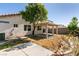 Backyard featuring a covered patio, a tree, and a block wall at 4439 Scarlet Sea Ave, North Las Vegas, NV 89031