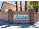 A welcoming brick sign for the Northbrook community entrance with palm trees in the background at 4439 Scarlet Sea Ave, North Las Vegas, NV 89031