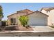 Charming single-story home with a two-car garage and well-maintained front yard at 4439 Scarlet Sea Ave, North Las Vegas, NV 89031