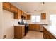 Updated kitchen showcasing stainless steel appliances, a functional layout, and plenty of natural light at 4439 Scarlet Sea Ave, North Las Vegas, NV 89031