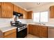 Close-up of kitchen featuring stainless steel appliances, gas range, and ample cabinet space, perfect for cooking enthusiasts at 4439 Scarlet Sea Ave, North Las Vegas, NV 89031