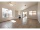 Bright living room featuring tile floors, a cozy fireplace, and sliding glass doors to the outdoor space at 4439 Scarlet Sea Ave, North Las Vegas, NV 89031