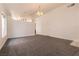 Open-concept living room featuring neutral paint, and stylish gray carpeting at 4439 Scarlet Sea Ave, North Las Vegas, NV 89031