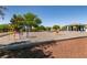 Colorful playground with swings, climbing structures, and gravel safety surface at 4439 Scarlet Sea Ave, North Las Vegas, NV 89031