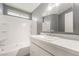 Clean bathroom with a tub and shower combination with a modern vanity and fixtures at 5155 Saratoga Dr, Las Vegas, NV 89120