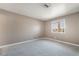 Carpeted bedroom with a window offering exterior views and ample natural light at 5155 Saratoga Dr, Las Vegas, NV 89120