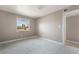 Cozy bedroom with plush carpeting and a bright window providing natural light at 5155 Saratoga Dr, Las Vegas, NV 89120