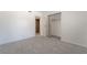 An ample bedroom offers neutral carpeting and access to closet and en suite bathroom at 5155 Saratoga Dr, Las Vegas, NV 89120