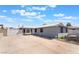 Charming single story home featuring a gray exterior, white trim, and spacious concrete driveway at 5155 Saratoga Dr, Las Vegas, NV 89120