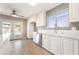 Bright kitchen showcasing modern white cabinets, stainless steel appliances, and view of the backyard pool at 5155 Saratoga Dr, Las Vegas, NV 89120