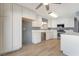 Bright, newly renovated kitchen featuring white cabinetry, stainless steel appliances, and tile floors at 5155 Saratoga Dr, Las Vegas, NV 89120