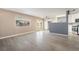 Inviting living room with a ceiling fan, tile flooring, and access to backyard through glass doors at 5155 Saratoga Dr, Las Vegas, NV 89120
