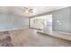 Bright living room with tile flooring, a ceiling fan, an open layout, and light gray walls at 5155 Saratoga Dr, Las Vegas, NV 89120