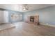 Inviting living room with a brick fireplace, tile floors, and windows with a seating ledge at 5155 Saratoga Dr, Las Vegas, NV 89120