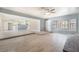 Spacious living room featuring tile flooring, gray walls, an open layout and large window at 5155 Saratoga Dr, Las Vegas, NV 89120