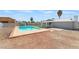 Backyard pool with desert landscaping and a covered patio offers a relaxing outdoor space at 5155 Saratoga Dr, Las Vegas, NV 89120