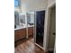 Bathroom featuring a mirrored closet and wood floors at 5717 Blizzard Breeze St, North Las Vegas, NV 89081